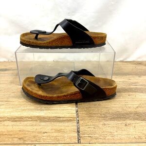 Birkenstock Black Strap Sandals with Brown Footbed